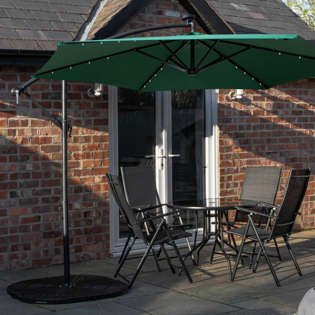 Samuel Alexander 4 Seater Glass Top Foldable Dining Set with Green Banana Lit Parasol and Base - Black - Wilko - image 1