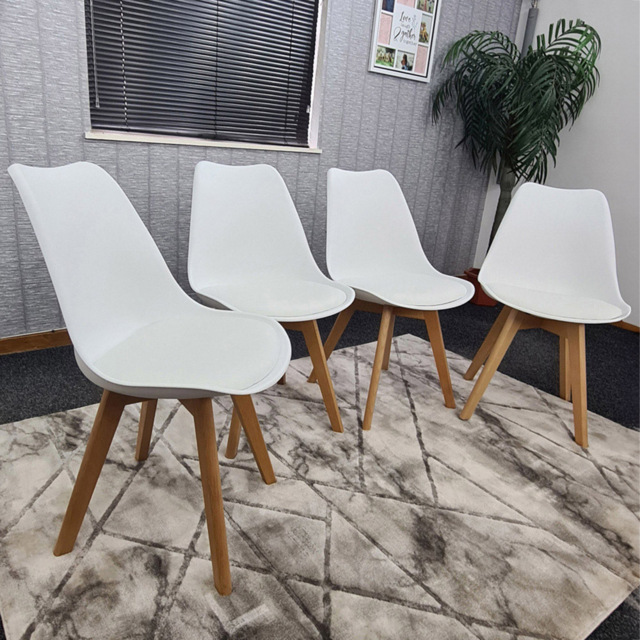 Kosy Koala Set of 4 White Plastic Dining Chair with Faux Leather Padded Seat - Size: 83 x 57 x 49cm - Wilko - image 1